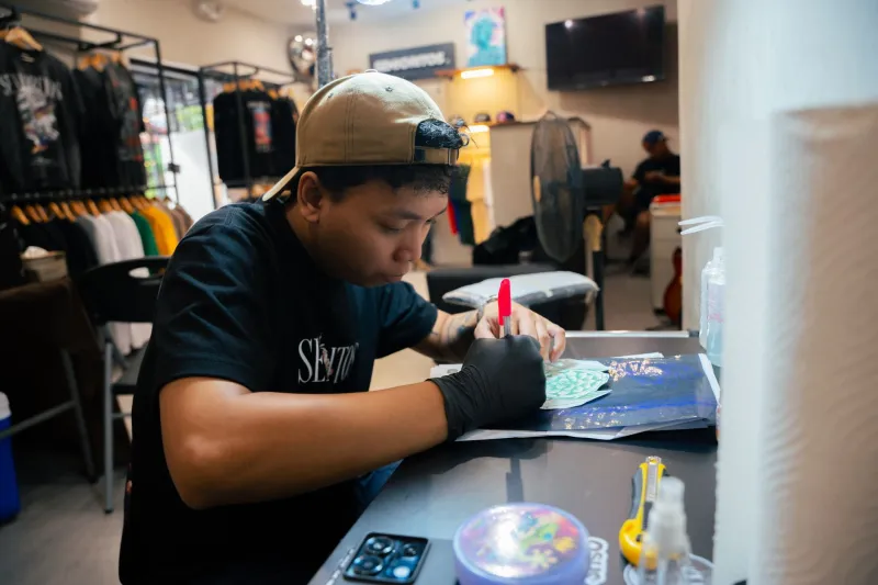 Cotton and Canvas: The Graphic Artists Stitching British Music's Visual Soul Into Every Tour Tee